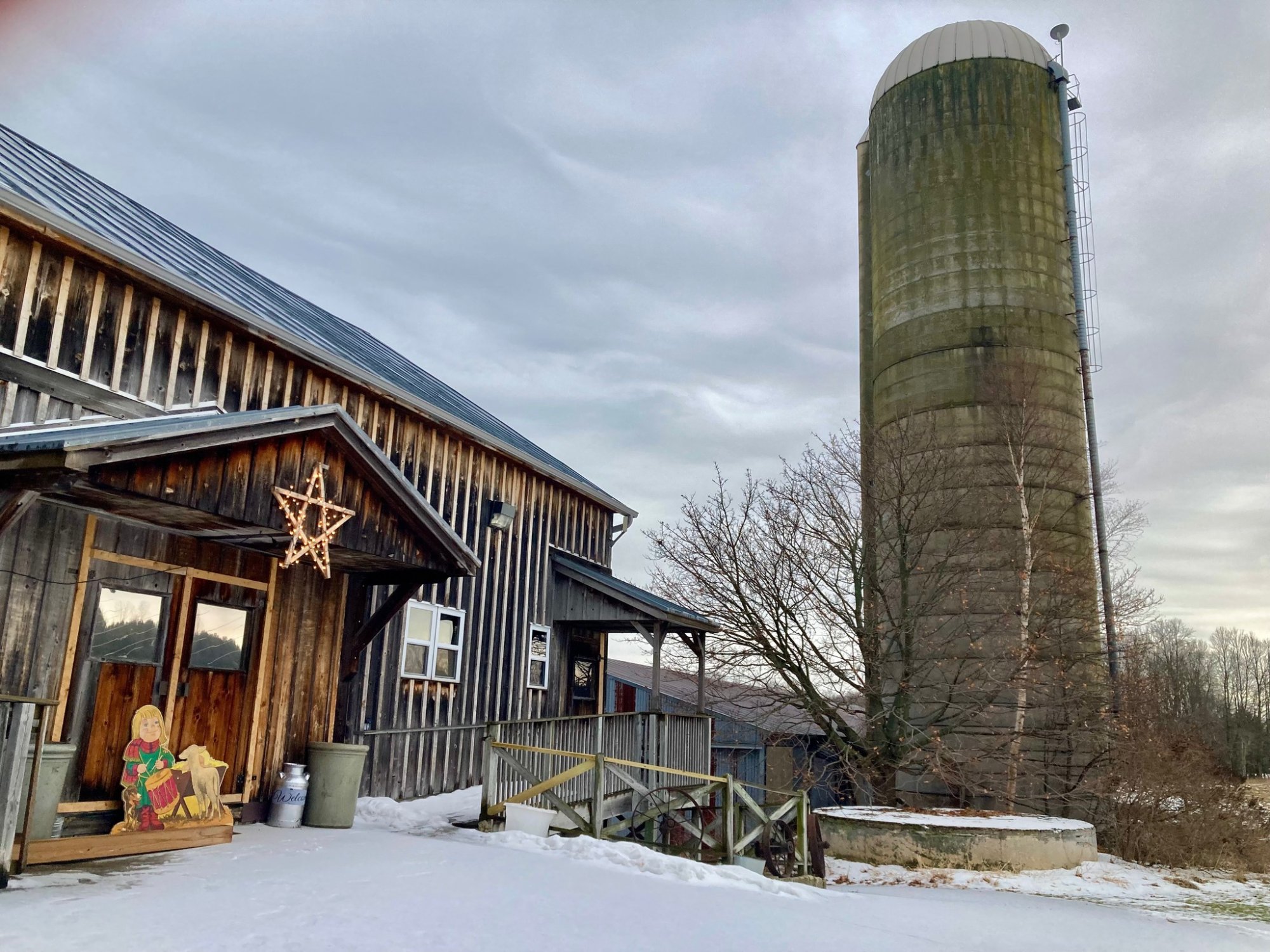 The Taube Farm historic barn and silo in winter