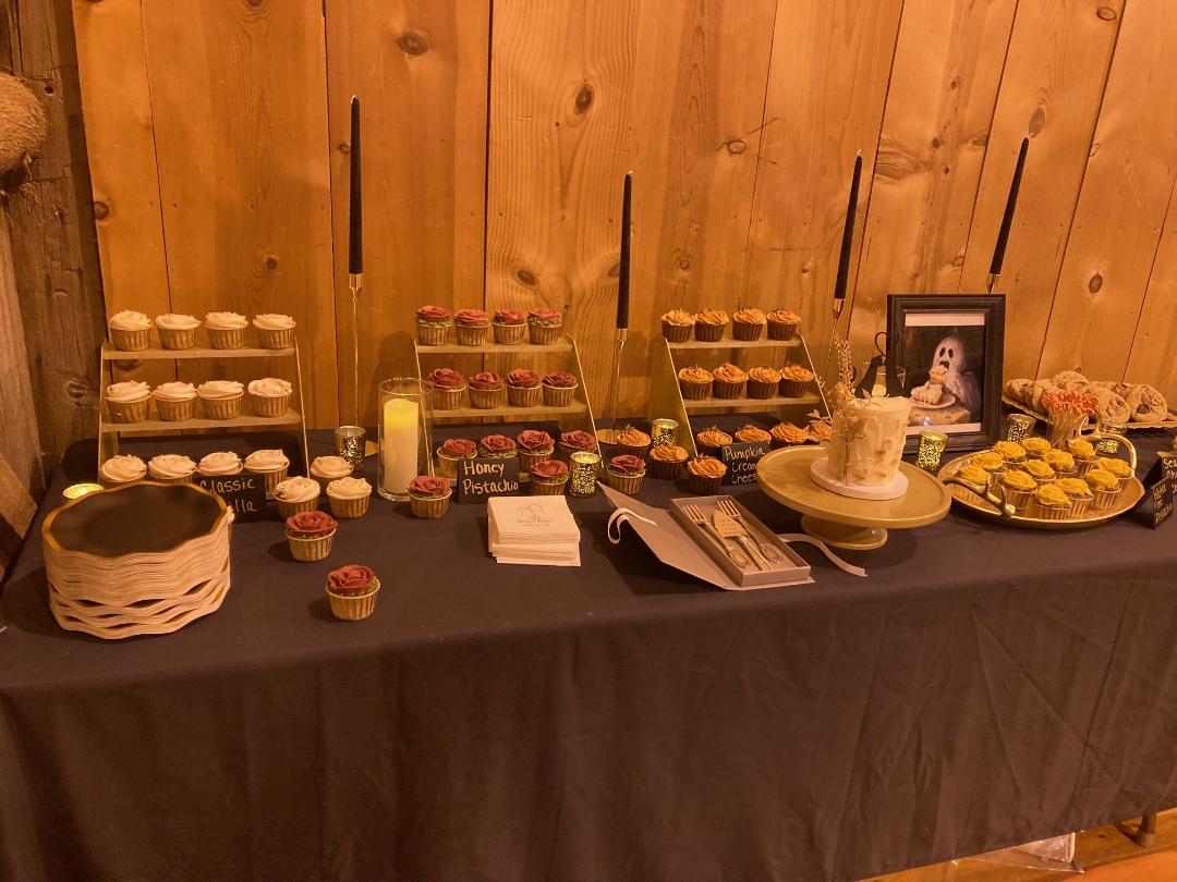 Elegant cupcake dessert table at a barn event